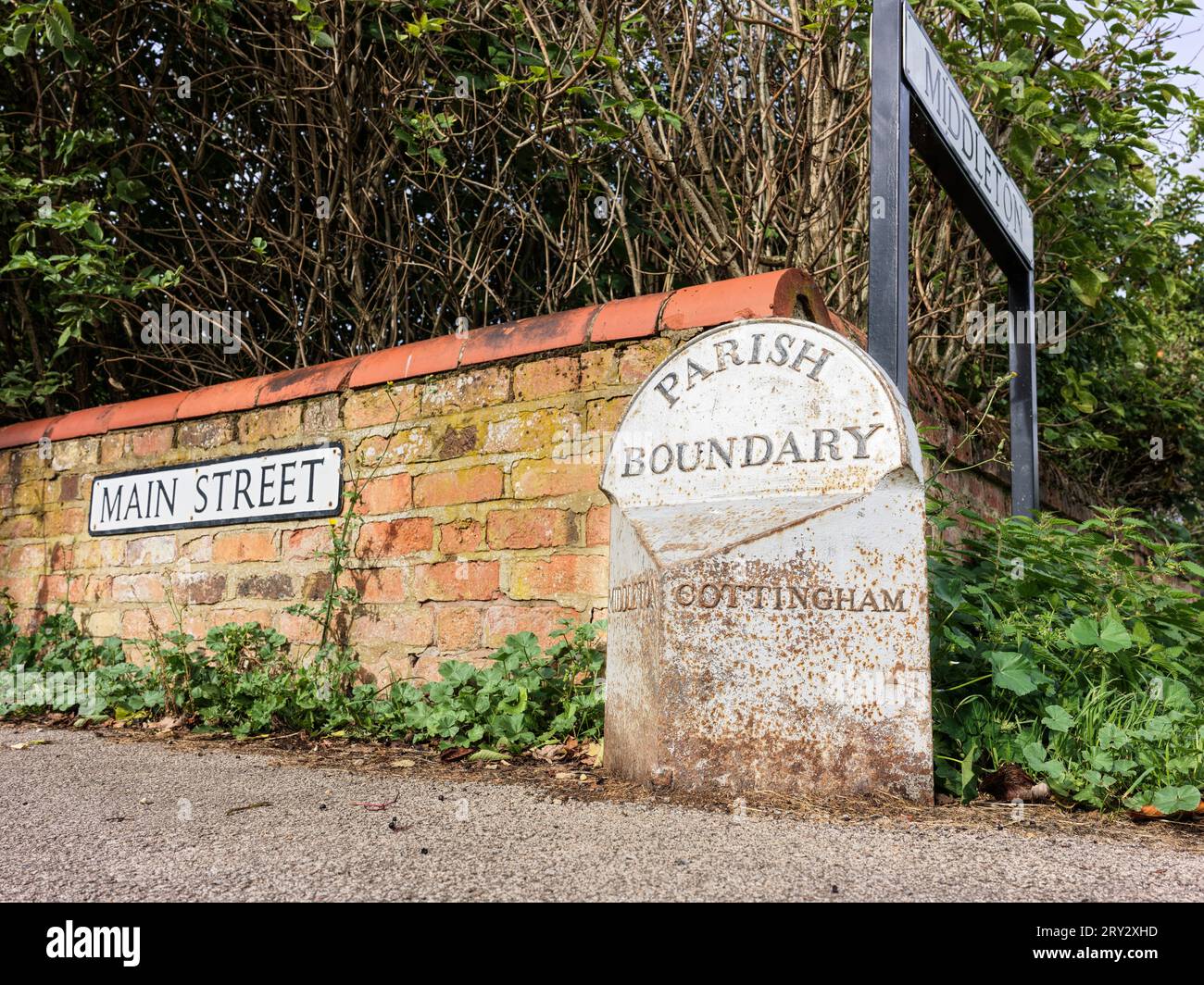 Old parish boundary sign separating the villages of Cottingham and