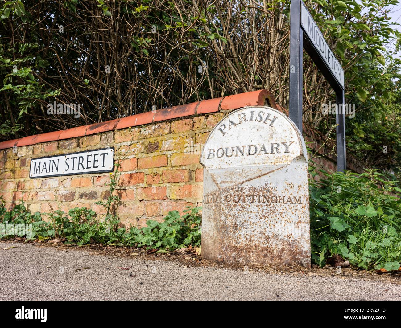 Old parish boundary sign separating the villages of Cottingham and Middleton, Northamptonshire, England. Stock Photo