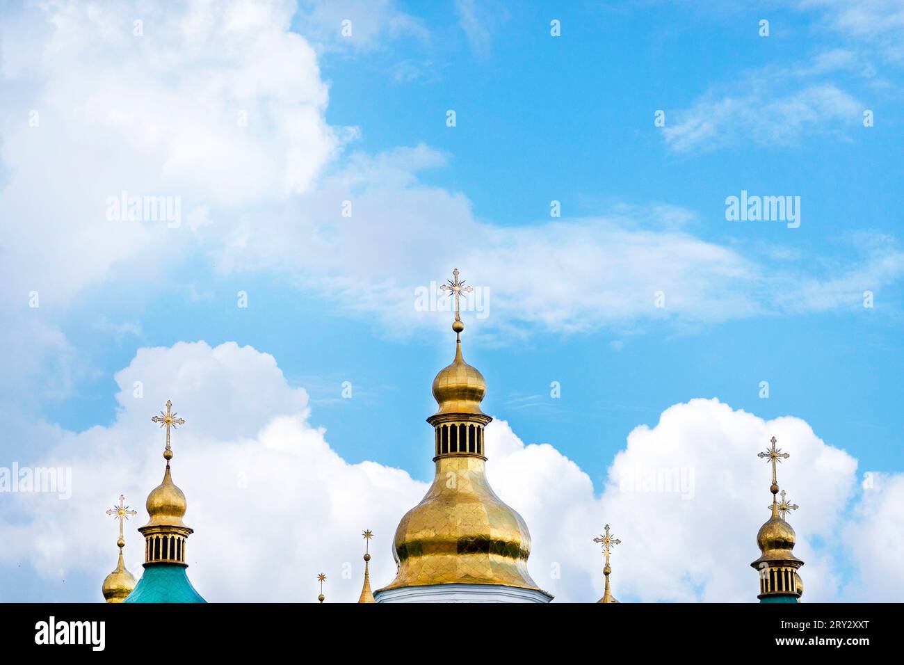 Gold domes of Christian churches. House of prayer. religion concept, faith in god. Domes with crosses against the background of the beautiful sky with Stock Photo