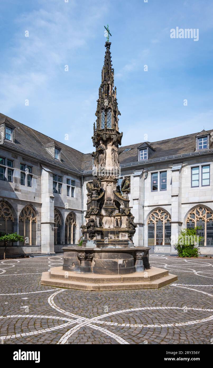 Aachen, Germany - September 3, 2023: Paradise fountain on inner courtyard of Aachen Cathedral Treasury museum. Stock Photo