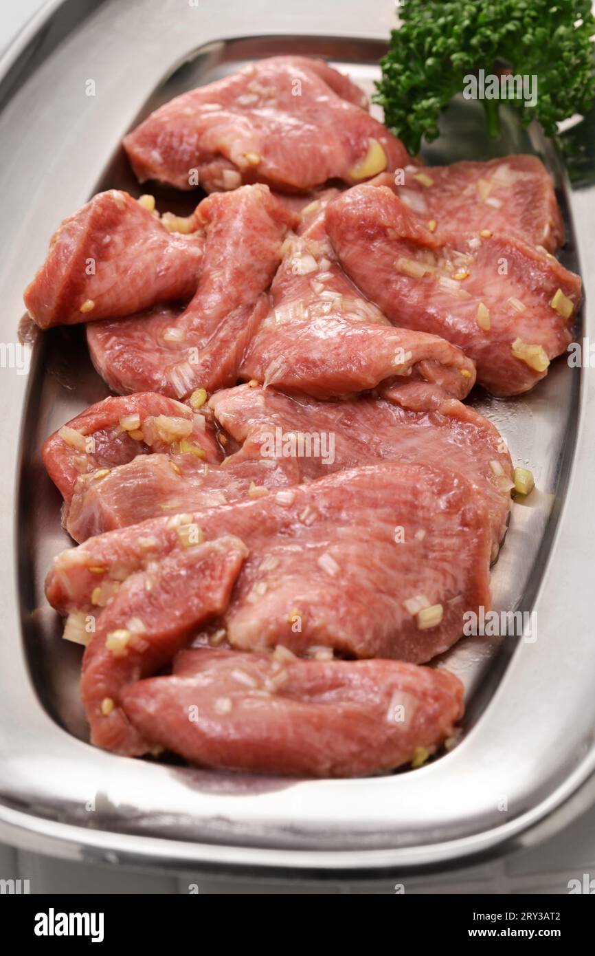 Beef tongue marinated with green onion sauce. Beef tongue is one of the popular ingredients for