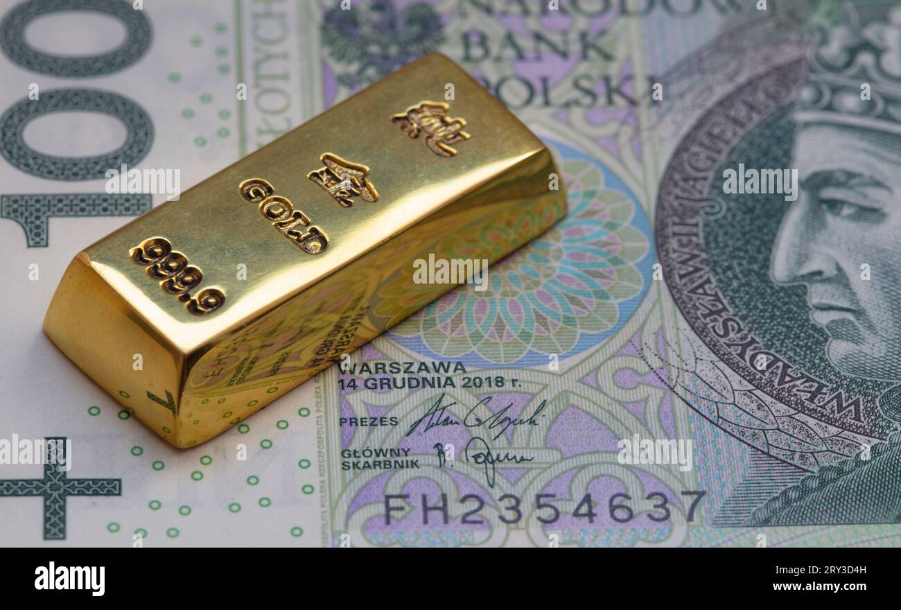 gold-bar-on-100-polish-zloty-banknote-background-for-design-purpose