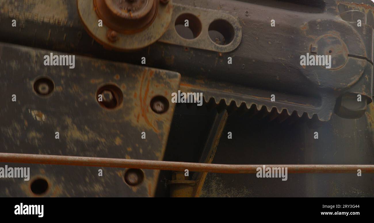 Pitman arm, counter weight and crank on a common oil-lifting pumpjack. Stock Photo