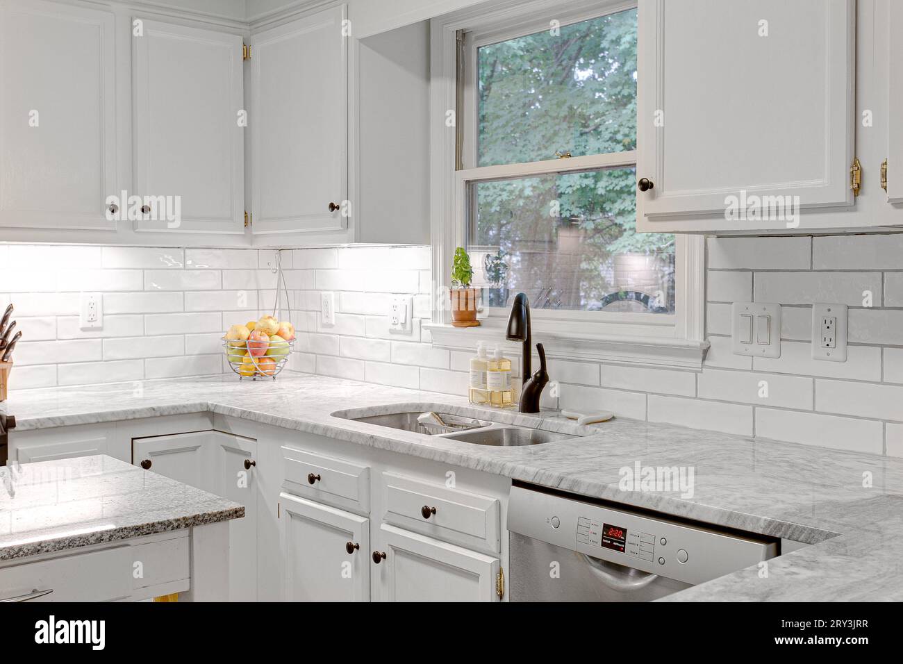 Clean Modern White Kitchen Interior with Stone Countertops and Granite