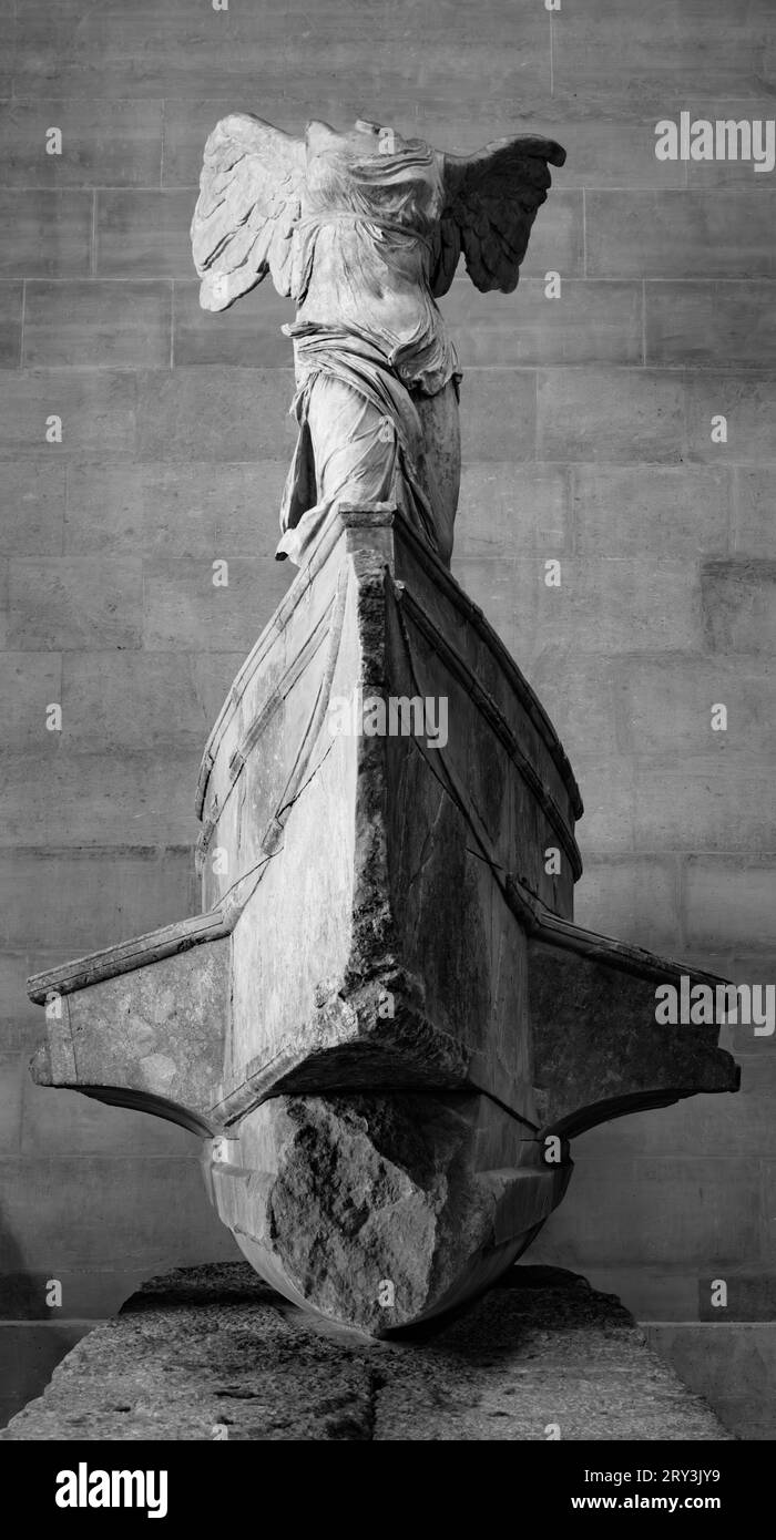 The Winged Victory of Samothrace, or the Nike of Samothrace. Exhibited at the Louvre Museum in Paris, at the top of the main staircase, since 1884. Black and white photography. Stock Photo
