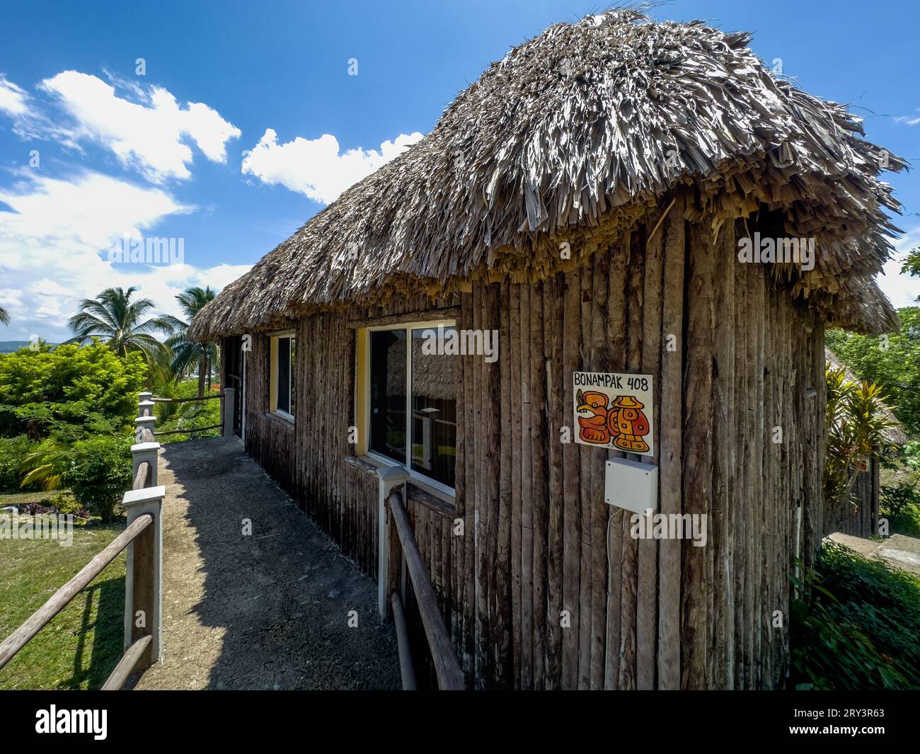 Rustic thatched-roof bungalows at the Cahal Pech Village Resort in San Ignacio, Cayo District, Belize. Stock Photo