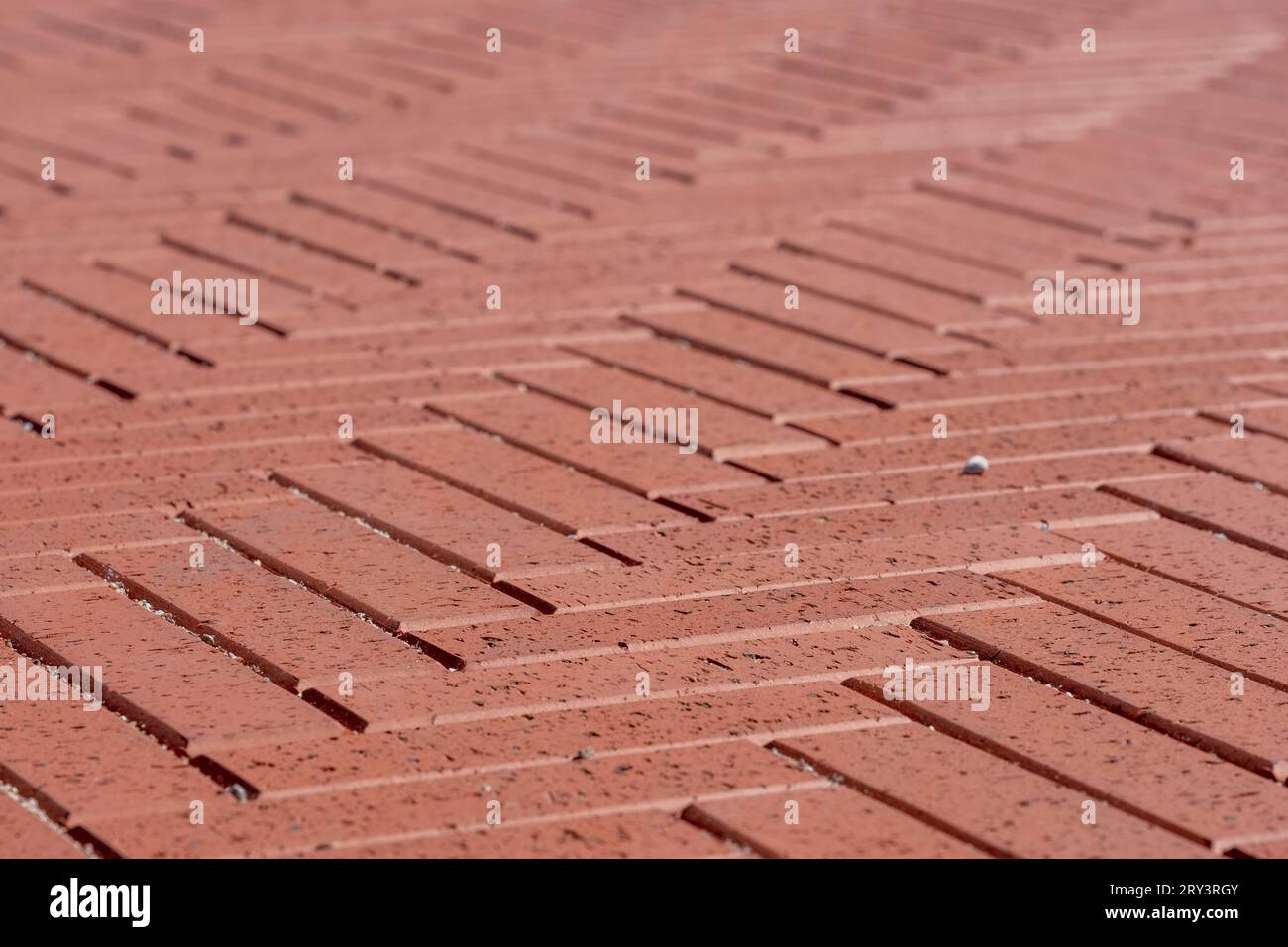 Sidewalk pavement in rust color, herringbone terracota pattern in ...