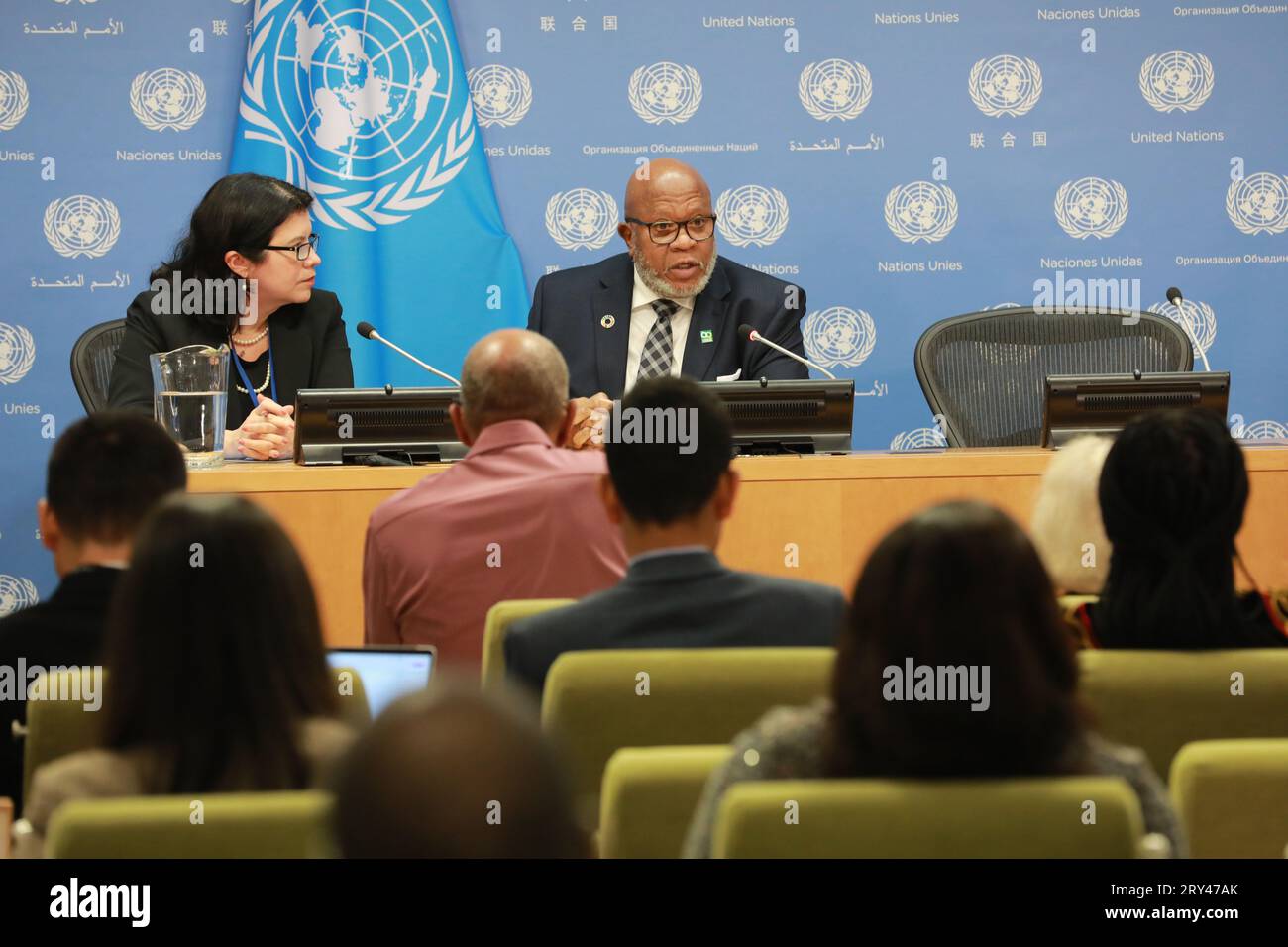 United Nations, Rear) speaks at a press briefing at the UN headquarters ...