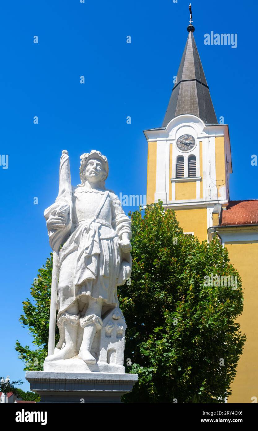 Lenti, Hungary - July 15, 2023: A white statue of Saint Florian, the patron saint of firefighters Stock Photo