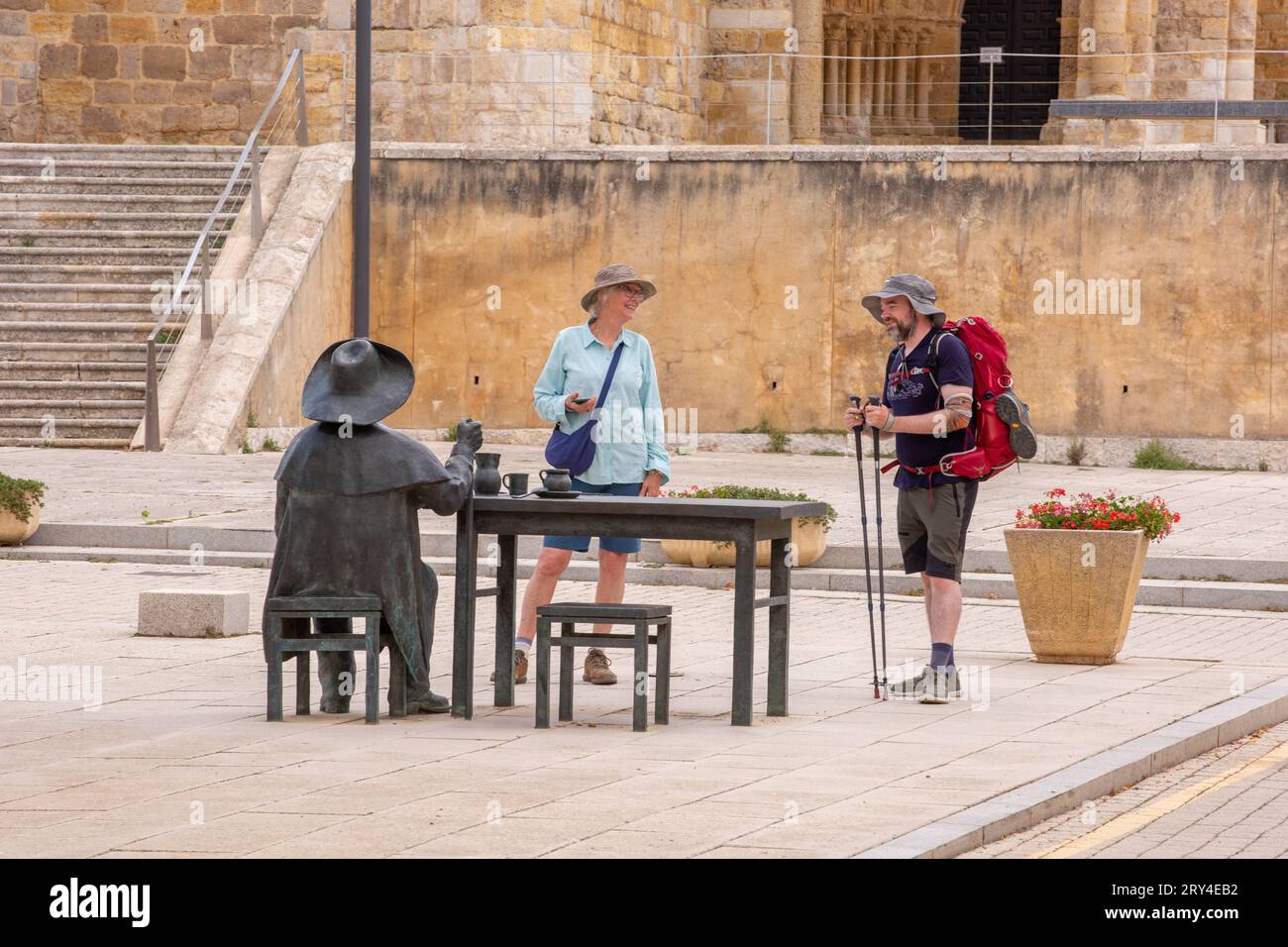 Pilgrims walking the Camino de Santiago pilgrimage route, the way of St James, in the Spanish ...