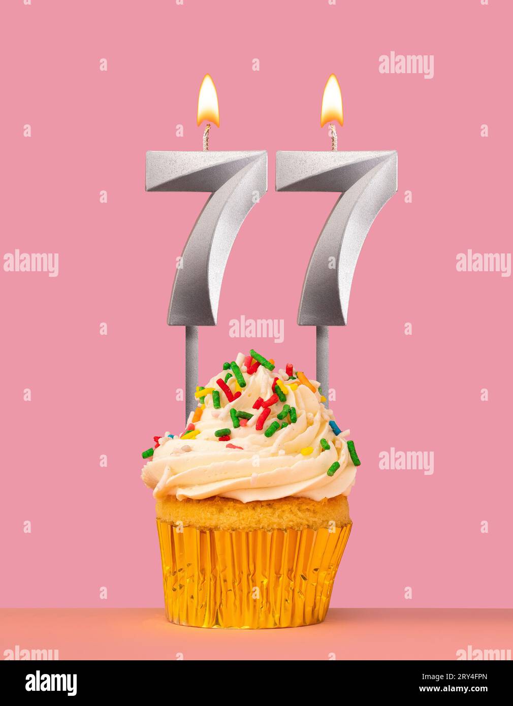 Birthday card with cupcake and candle number 77 Stock Photo