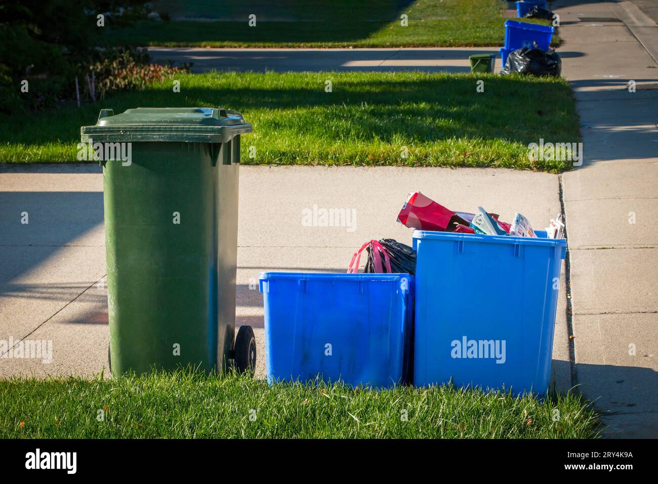 Close up of recycle and waste bins on roadside for pick up, waste