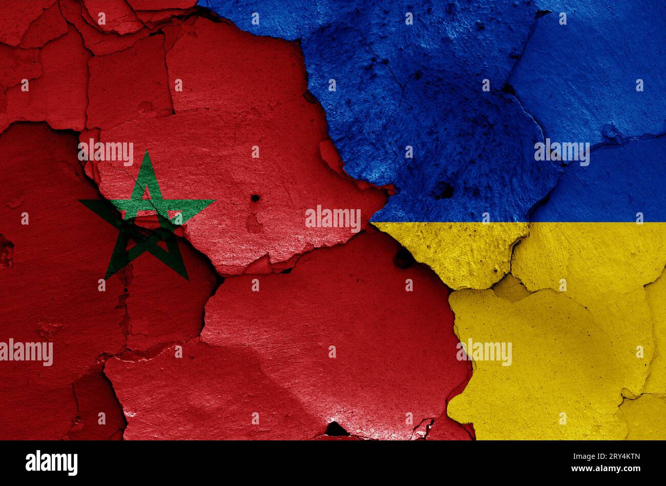 flags of Morocco and Ukraine painted on cracked wall Stock Photo