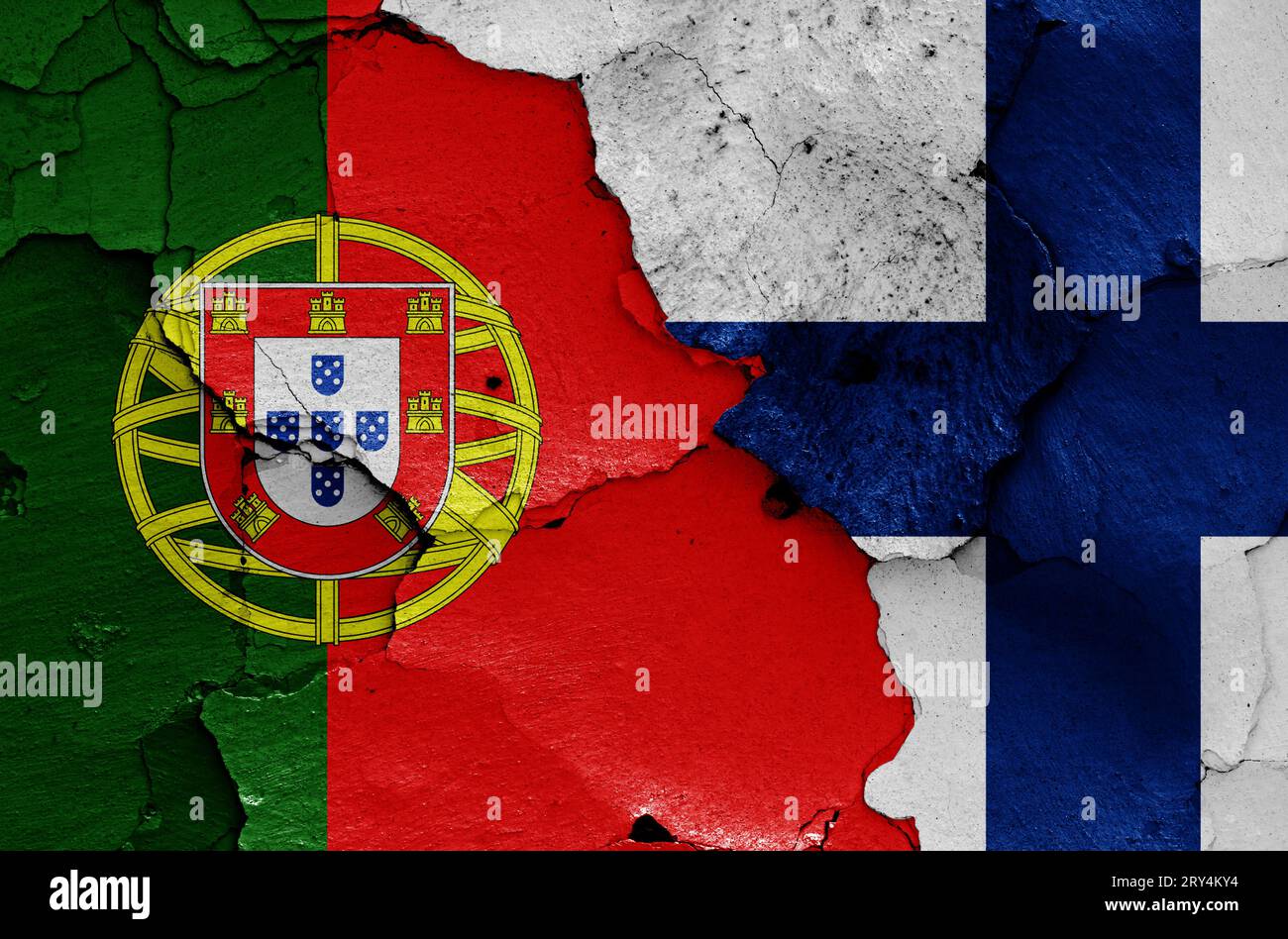 flags of Portugal and Finland painted on cracked wall Stock Photo