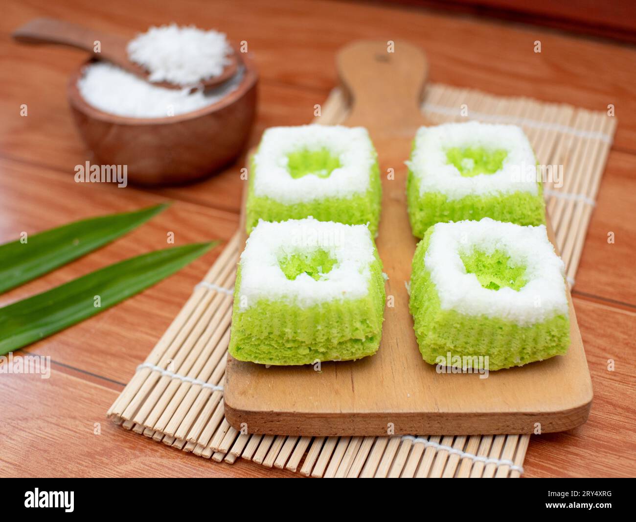 Putri Ayu is a sweet green cake topped with grated coconut, a popular Indonesian traditional food Stock Photo