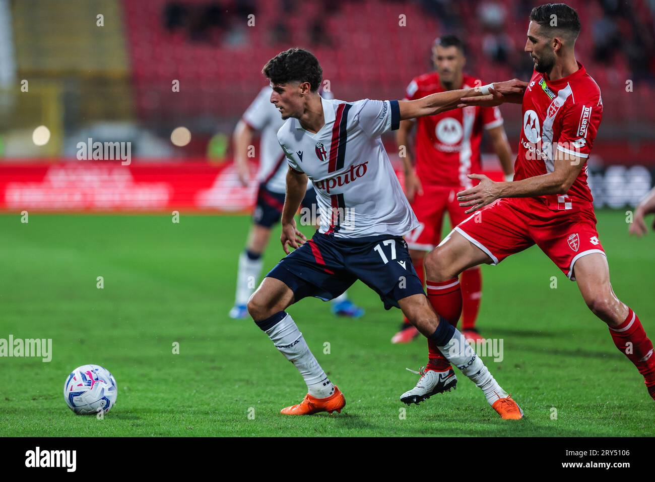 Monza, Italy. 28th Sep, 2023. Oussama El Azzouzi of Bologna FC (L) and