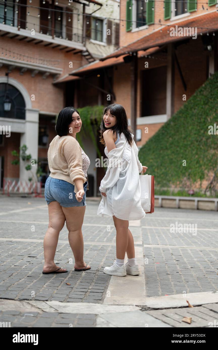 Two fat women walking on hi-res stock photography and images - Alamy