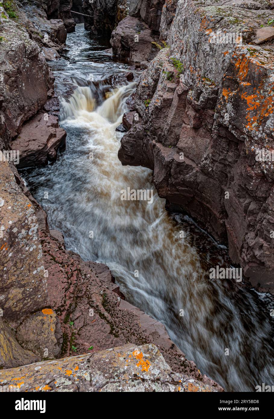 The Cascade River flows through rock canyons on its downhill rush to