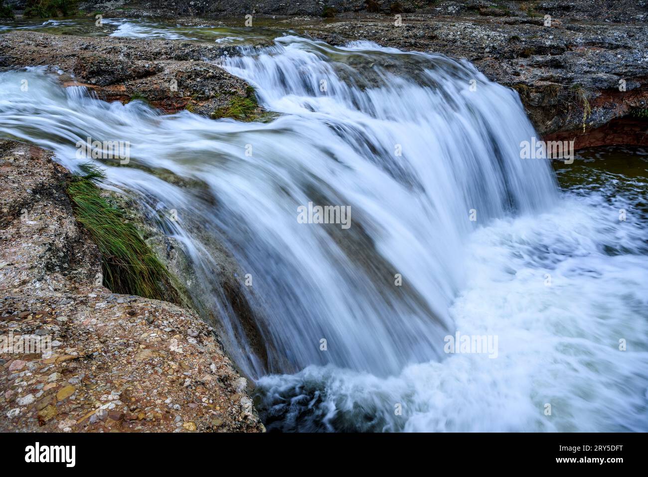 Toll del Vidre waterfall in the Algars river, in the Els Ports / Los Puertos natural park, with a large flow after heavy rains (Tarragona, Spain) Stock Photo