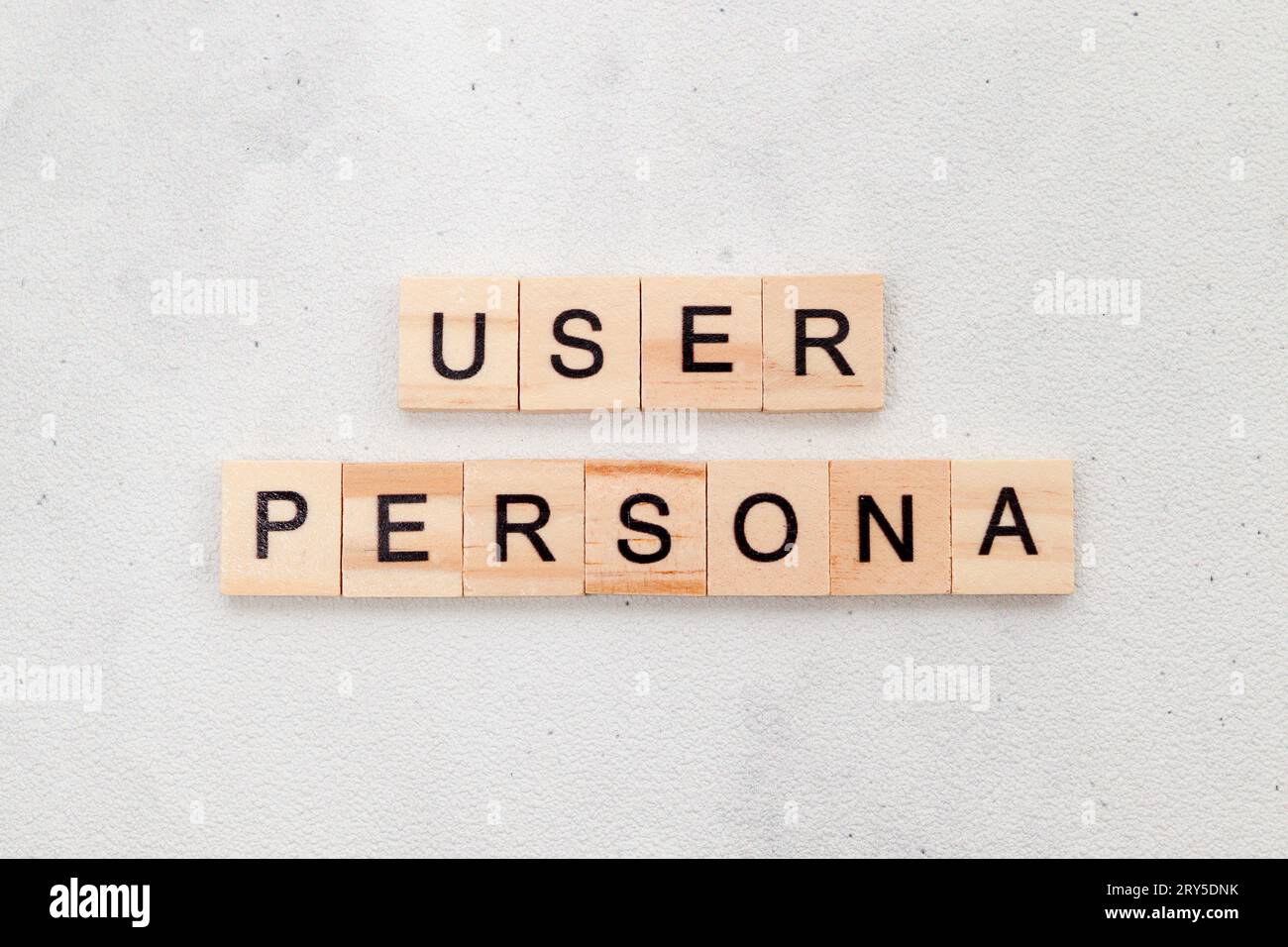 Top view of User Persona word on wooden cube letter block on white background. User interface and experience concept Stock Photo