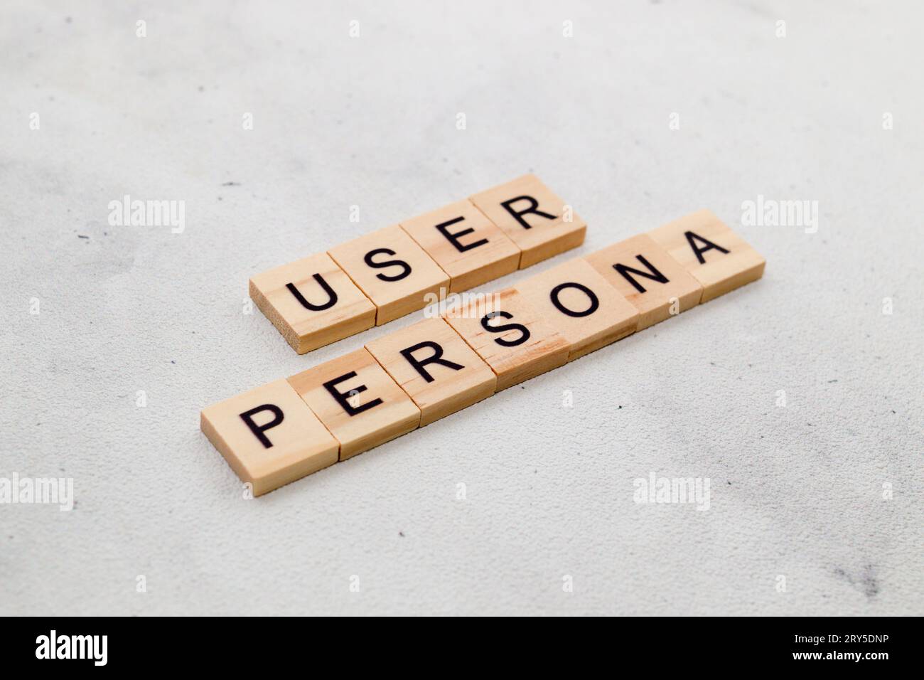 Top view of User Persona word on wooden cube letter block on white background. User interface and experience concept Stock Photo