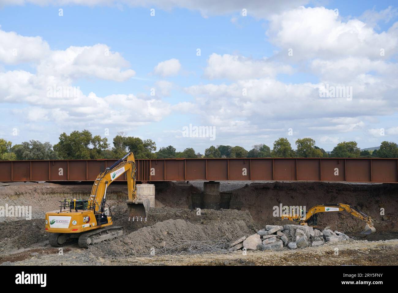 File photo dated 25/09/23 of HS2 contractors excavating an area below a newly replaced section of the Aylesbury to Princes Risborough branch line track which will allow the high speed rail to pass underneath. Stock Photo