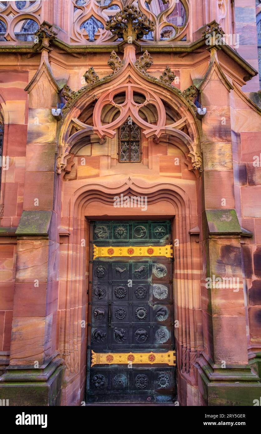 Ornate Gothic facade and side door of the Notre Dame Cathedral in Strasbourg, Alsace, France, one of the most beautiful Gothic cathedrals in Europe Stock Photo