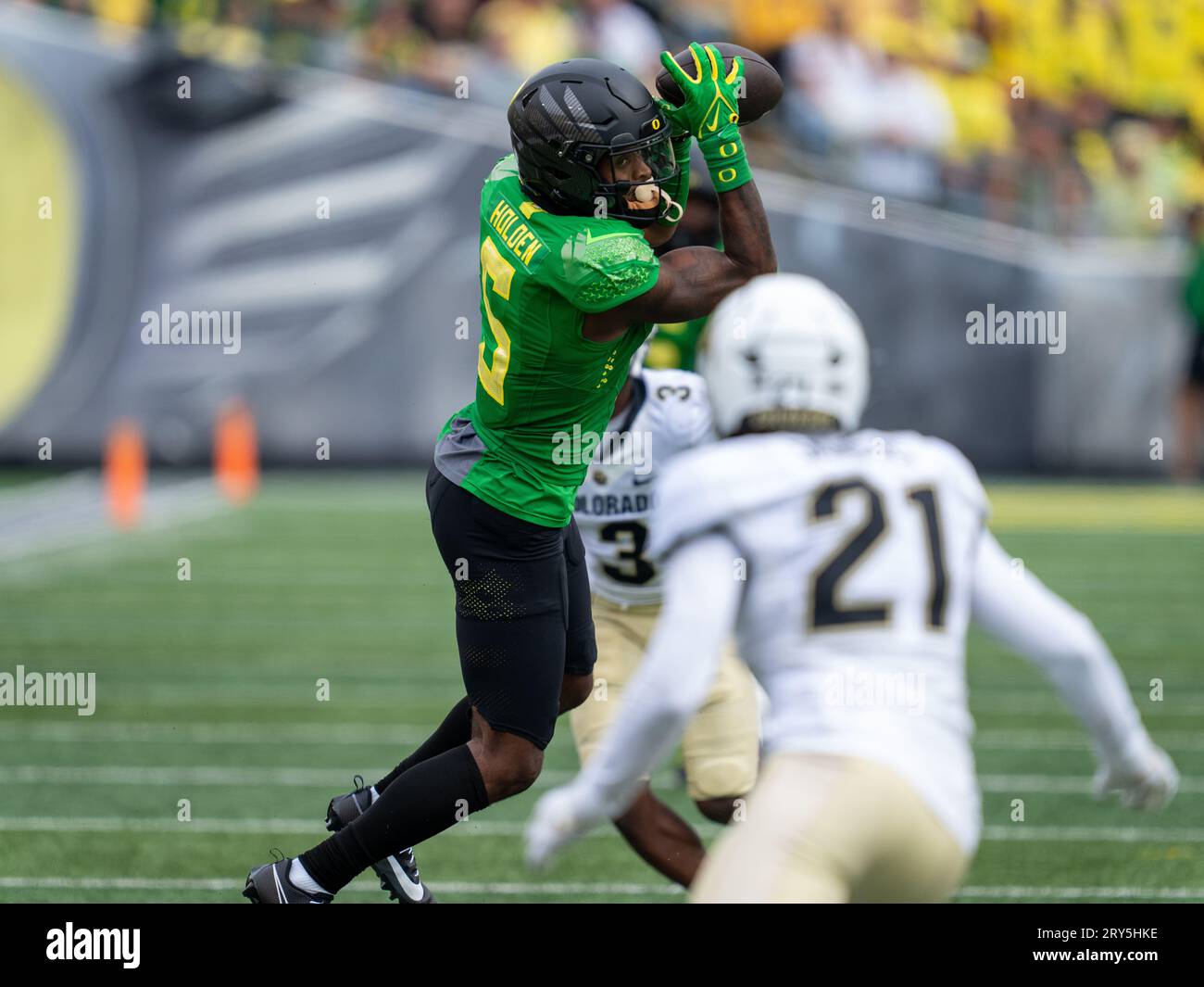 Oregon Ducks wide receiver Traeshon Holden (5) catches a pass while  Colorado Buffaloes safety Shilo Sanders (21) attempts to tackle him during  a NCAA Stock Photo - Alamy