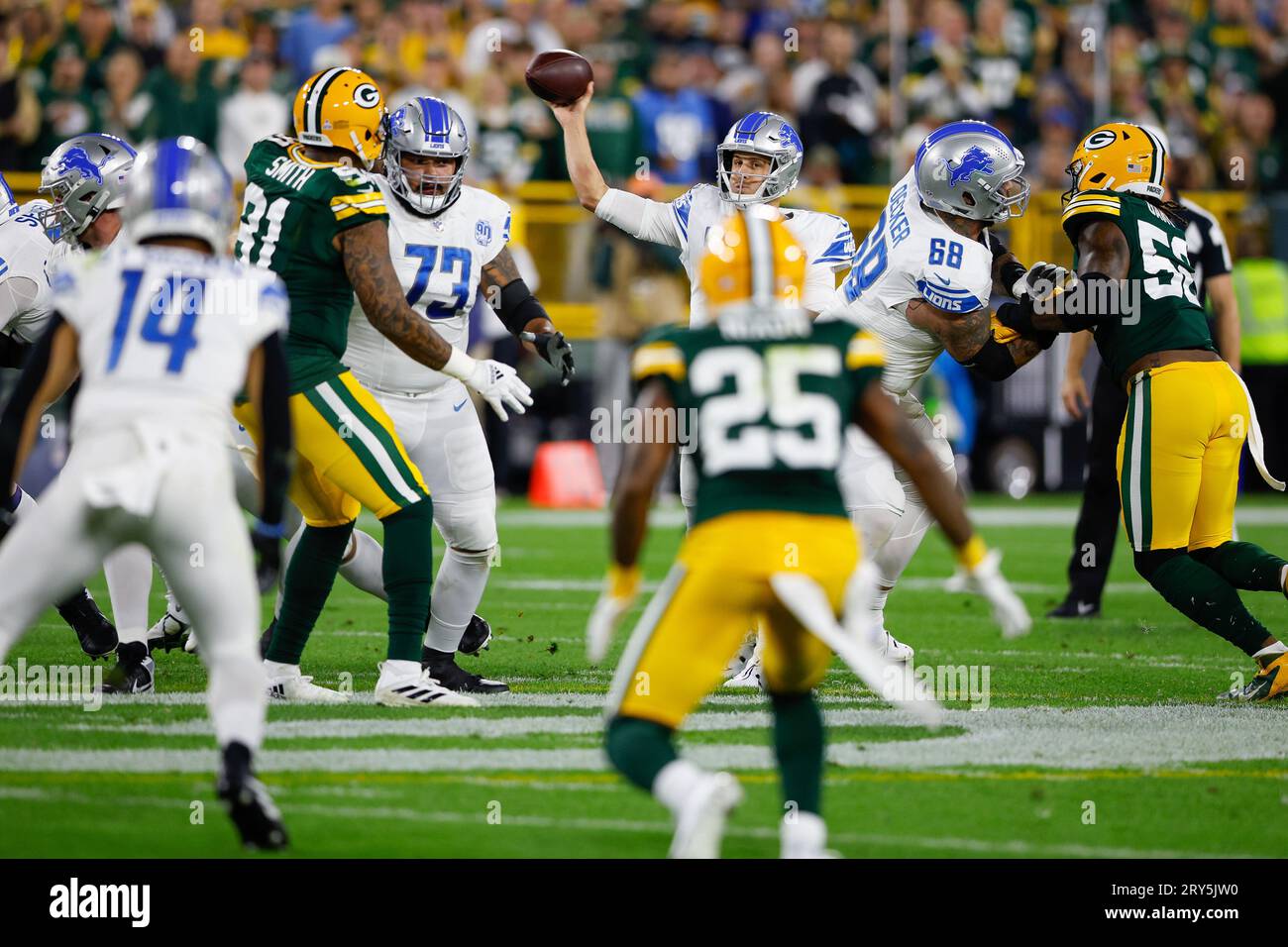 September 28, 2023: Detroit Lions quarterback Jared Goff (16) passes the ball to wide receiver Amon-Ra St. Brown (14) during the NFL football game between the Detroit Lions and the Green Bay Packers at Lambeau Field in Green Bay, Wisconsin. Darren Lee/CSM Stock Photo
