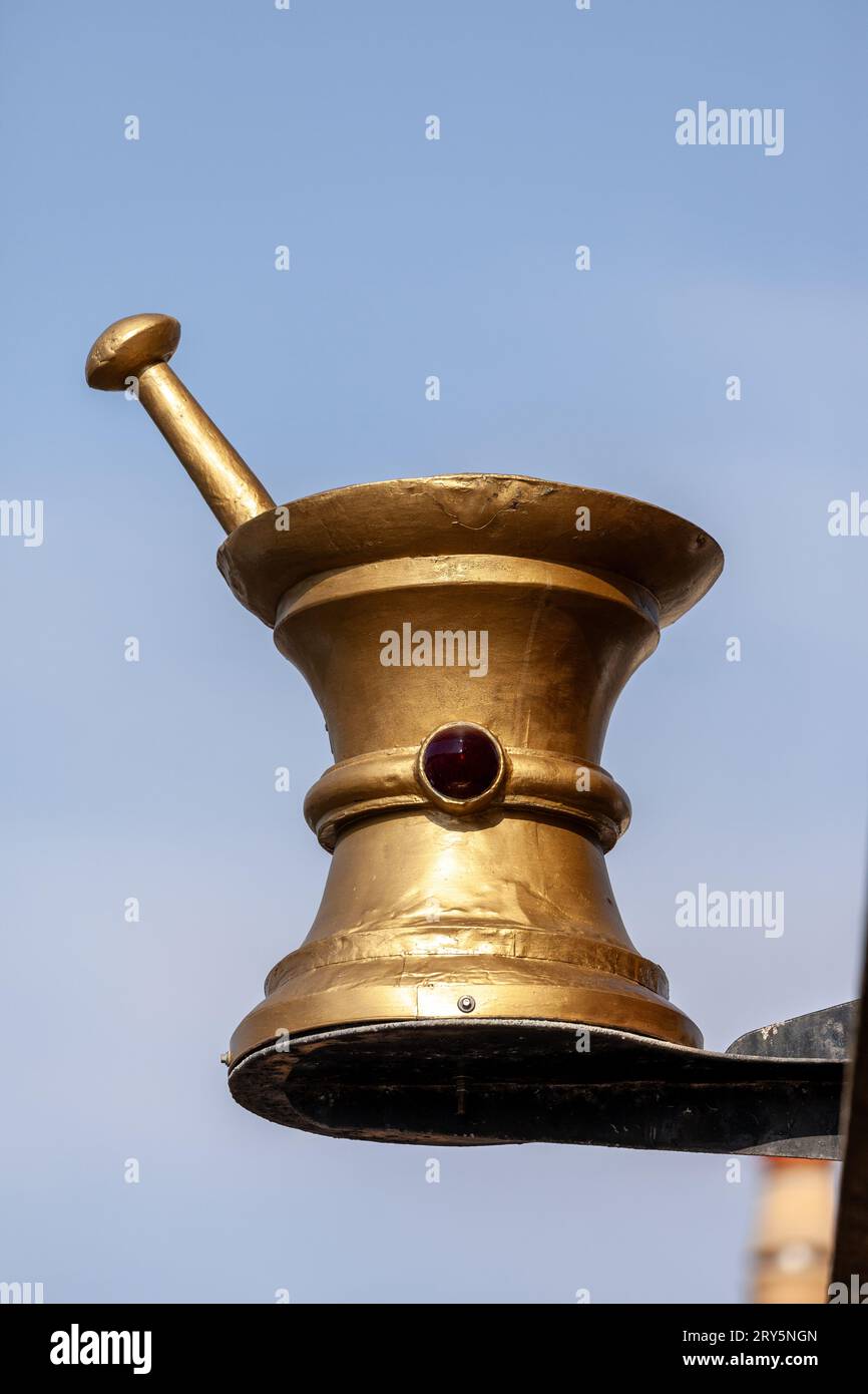 Traditional mortar and pestle sign on a building, indicating a dispensing pharmacy, Crail, Fife Stock Photo