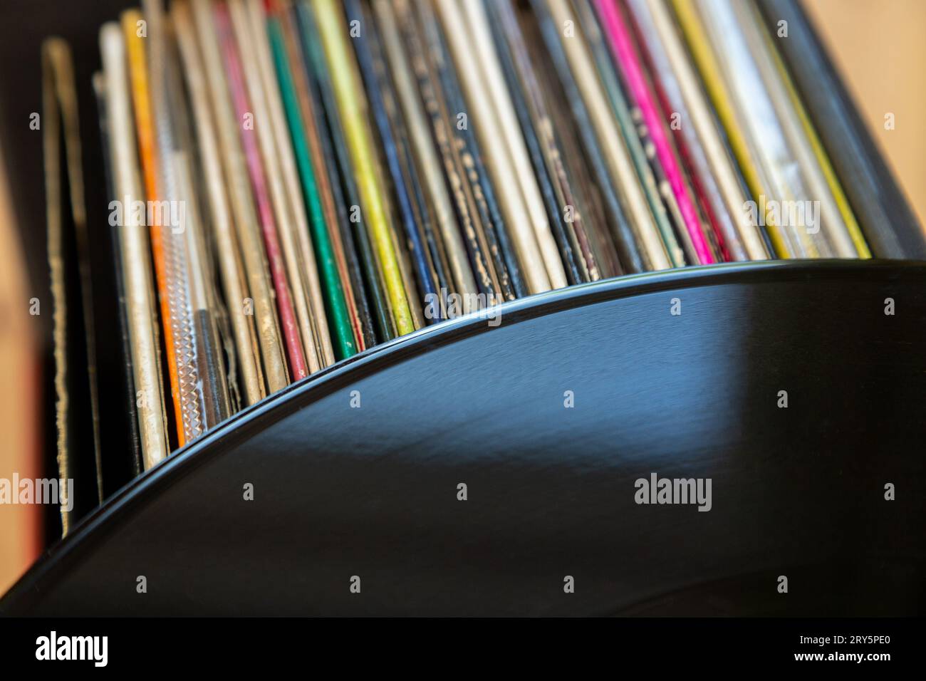 A Vinyl record on top of a collection of records Stock Photo Alamy