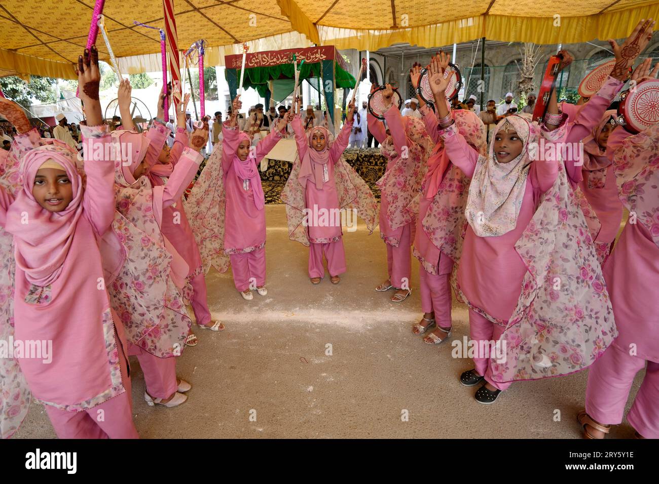 Girls in traditional dresses take part in a ceremony celebrating the  birthday of Islam's Prophet Muhammad, in Karachi, Pakistan, Friday, Sept.  29, 2023. Thousands of Muslims take part in religious processions,  ceremonies