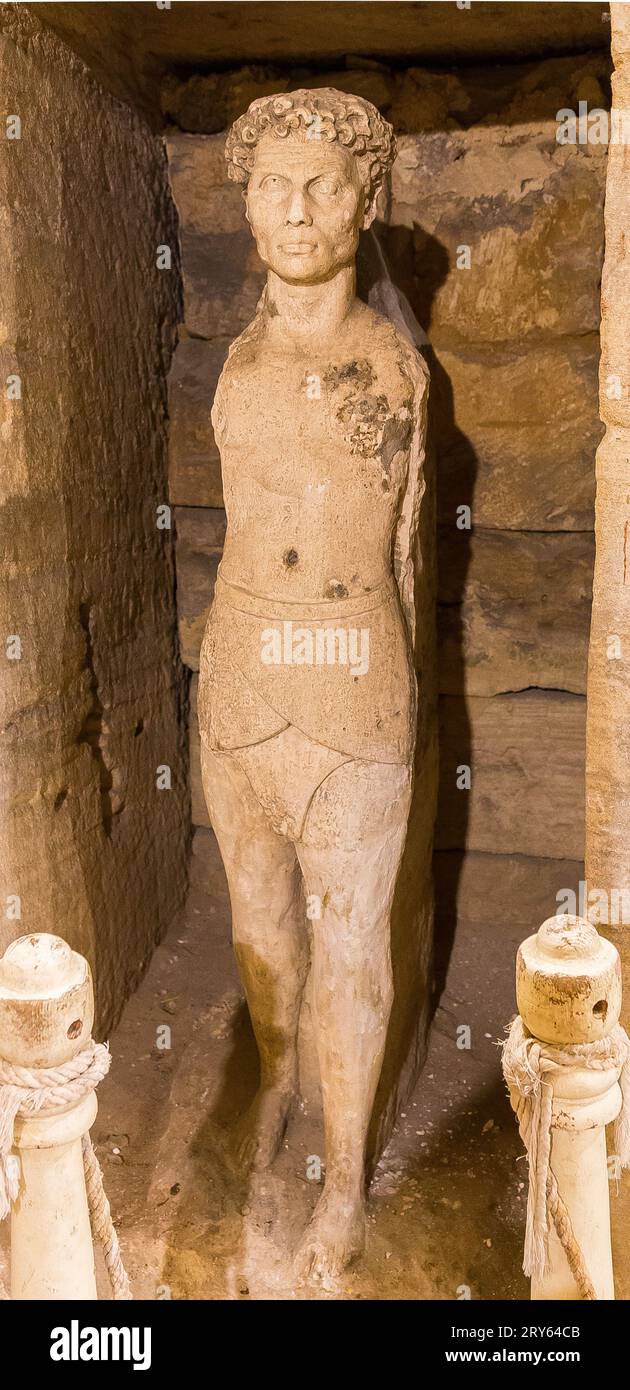 Kom el Shogafa necropolis, main tomb, antechamber : Statue of a man, mixing egyptian and roman characteristics. Stock Photo