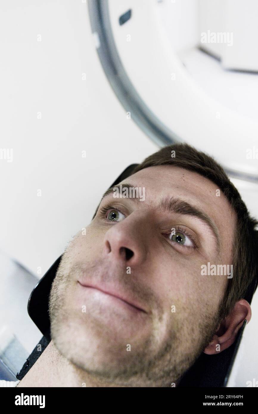 Close-up, portrait of a young about to have a MRI scan. Stock Photo