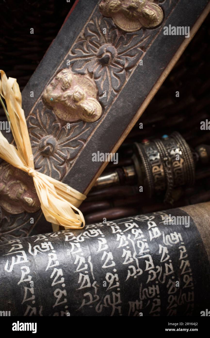 Close-up of Tibetan prayer holders and a prayer wheel. Stock Photo