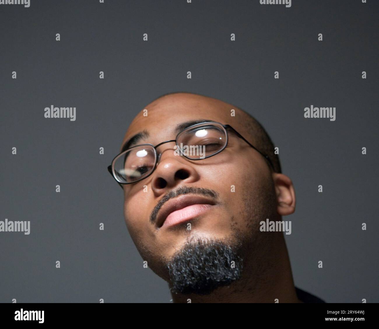 Young bald man wearing glasses hi-res stock photography and images - Alamy