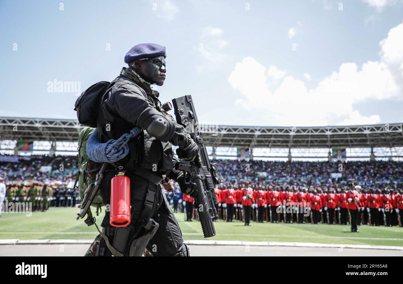 A member of The Tanzania Peoples Defence Force (TPDF) performs during ...