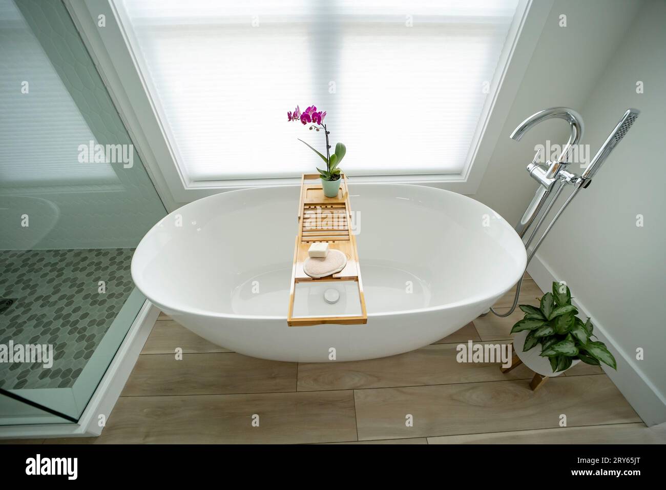 Elegant modern white freestanding bathtub with a tray Stock Photo