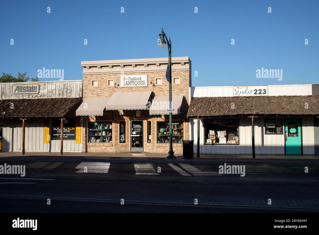 Small business store fronts on empty street Stock Photo