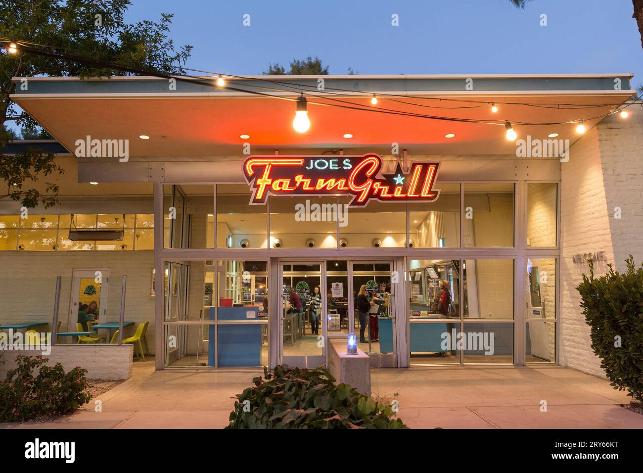 Joes Farm Grill restaurant exterior neon at dusk Stock Photo Alamy