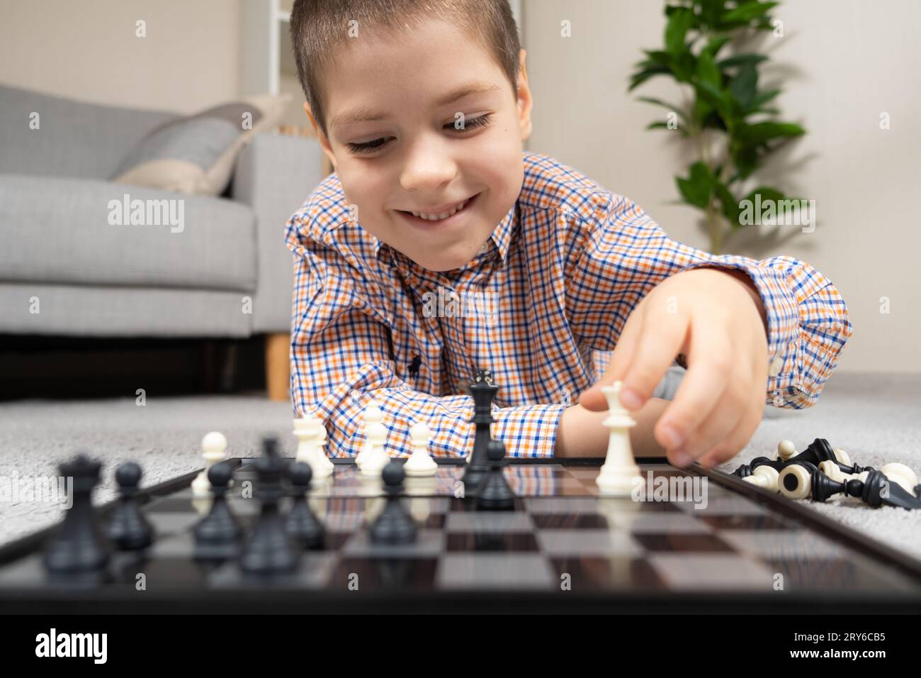 Little boy playing chess. Board games for children Stock Photo Alamy
