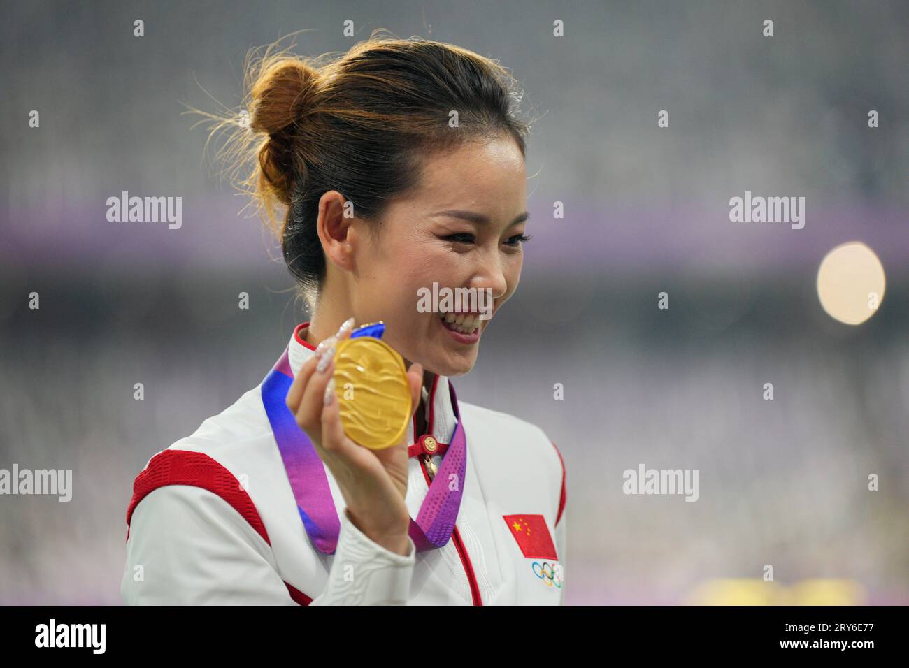 Gold medalists China's Yang Jiayu celebrates on the podium during the