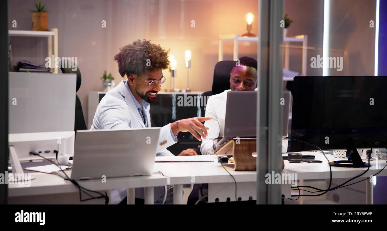 Business People Training On Computer. Young Workers In Office Stock Photo