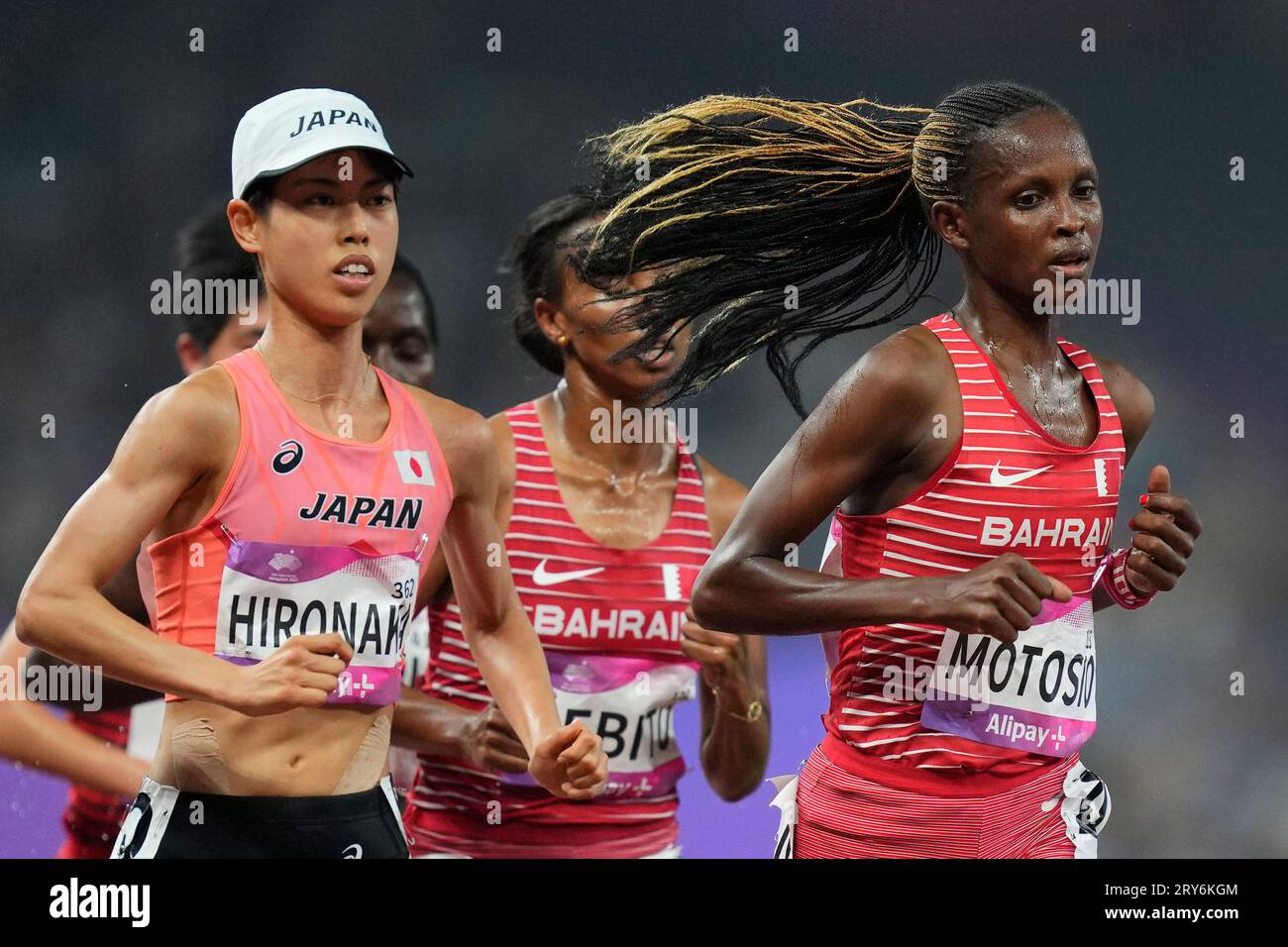Bahrain's Violah Jepchumba Kilonzo Motosio, right, competes with Japan