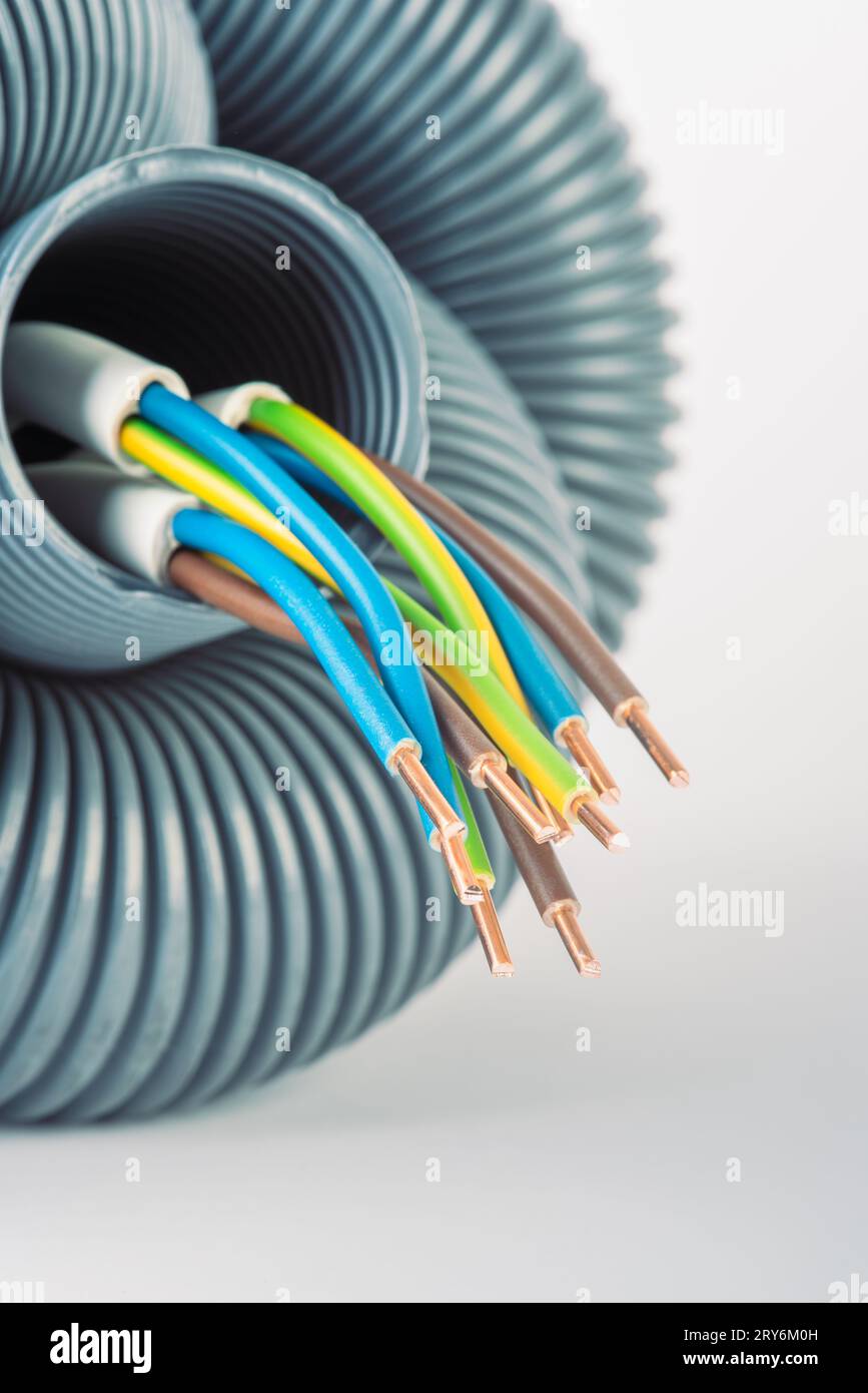 Electric Cable with Corrugated Conduit Protective Pipe Closeup Stock