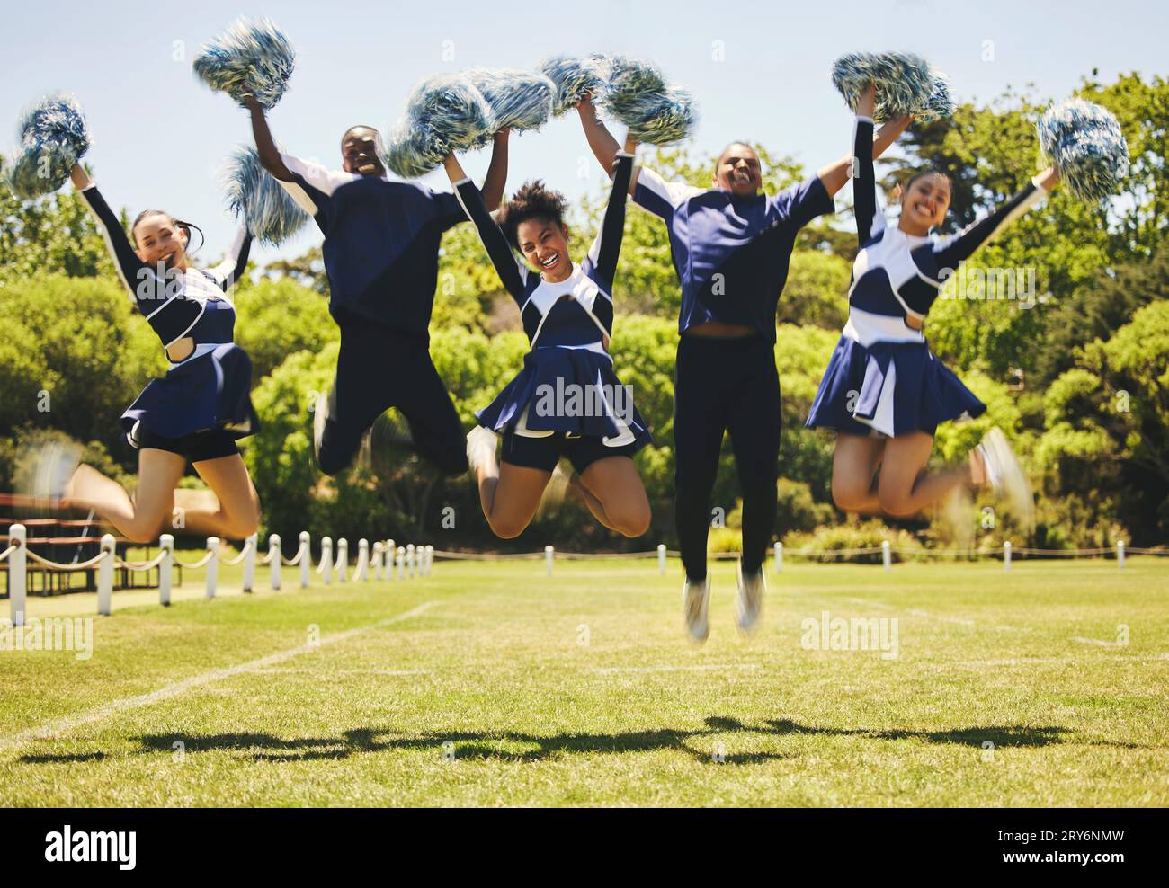 Cheerleader team portrait, people and jump for performance on field