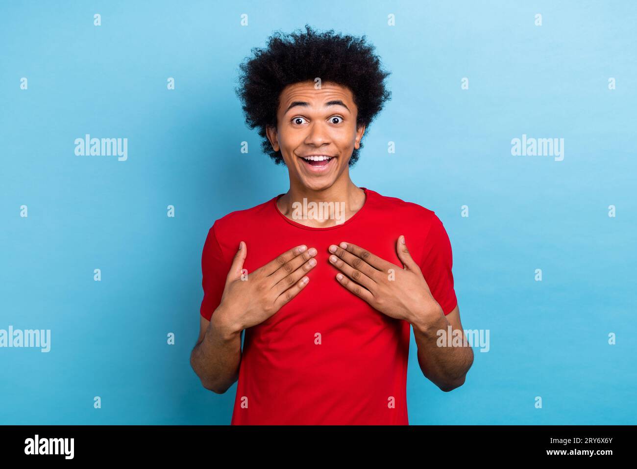 Portrait Of Impressed Positive Man Arms Touch Chest Open Mouth Cant Believe Isolated On Blue