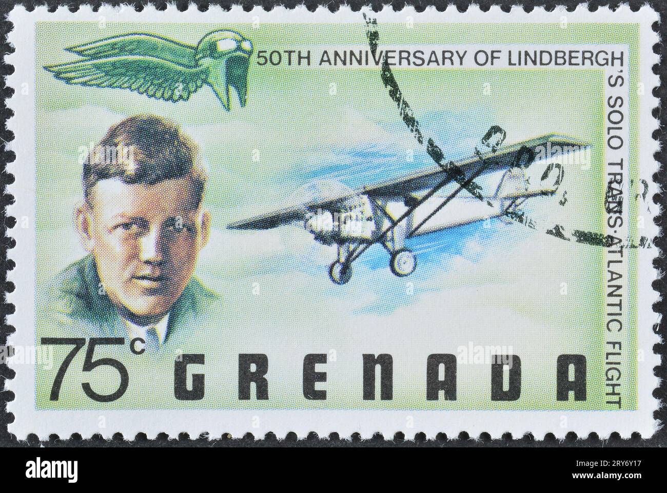 Cancelled postage stamp printed by Grenada, that celebrates 50th anniversary of Lindbergh's first solo transatlantic flight, circa 1977. Stock Photo