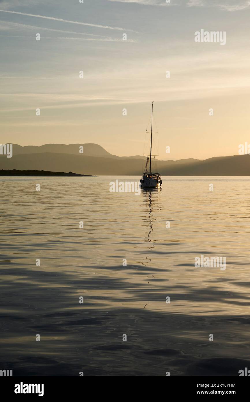 Sailing boat at anchor in Port Leone, Kalamos Island, Ionian, Greece. Stock Photo