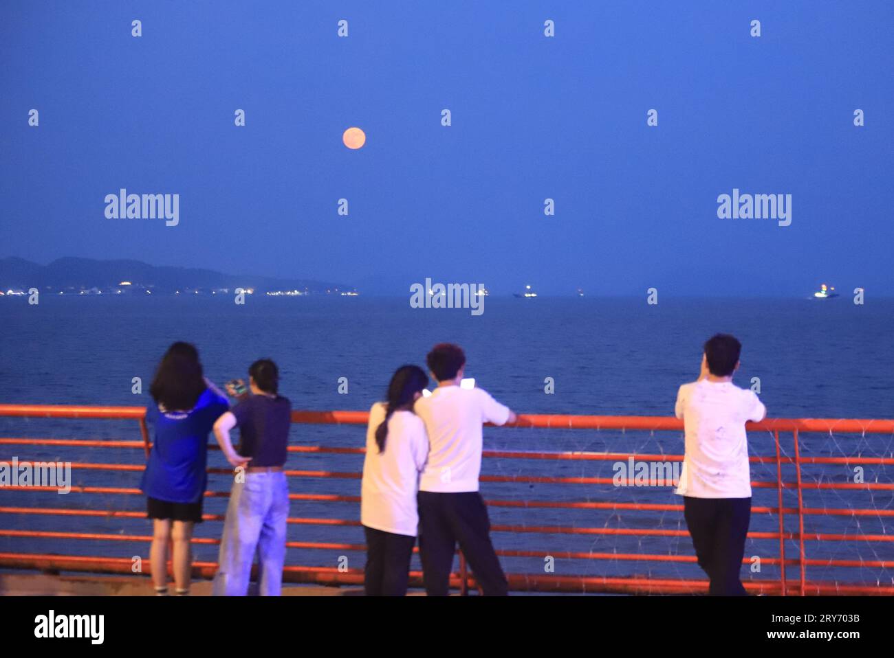 Beijing, China's Zhejiang Province. 29th Sep, 2023. People view a full ...